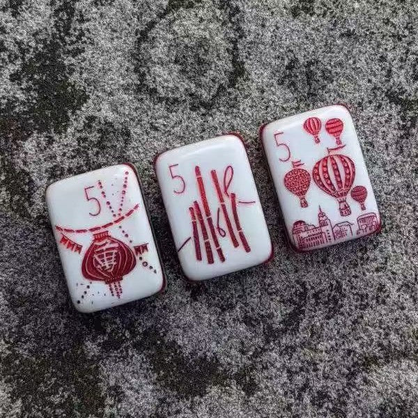 Hand-painted red Cracks and lantern mahjong tiles detail